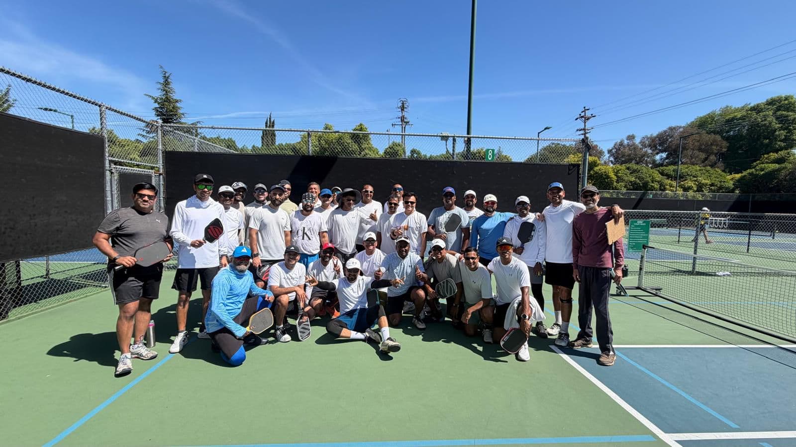 Participants gathered on court for the 10th Cambrian Pickleball Tournament.